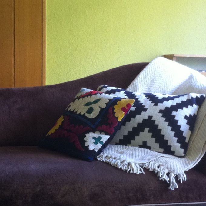 An Ikea pillow getting cozy with one from the Grand Bazaar in Istanbul. On a brown chaise that I scored for just $200 at a now-defunct Washington DC furniture store. 
